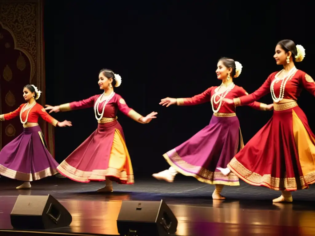 Danza Kathak India significado cultural: Bailarinas de Kathak con trajes tradicionales en un escenario grandioso, expresivo y cautivador