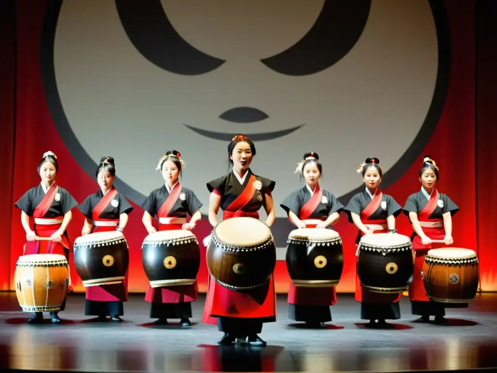 Grupo de artistas ejecutando la Danza de tambores Taiko Japón, con pasión y energía en el escenario, mientras el público observa maravillado