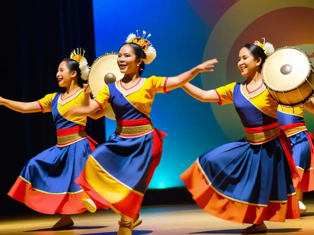 Un grupo de bailarines tradicionales filipinos en trajes vibrantes, moviéndose graciosamente al ritmo del ensamble de gong en danza